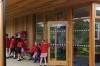 Children on the covered decking of their eco-classroom The Learning Escape @ Cherry Orchard